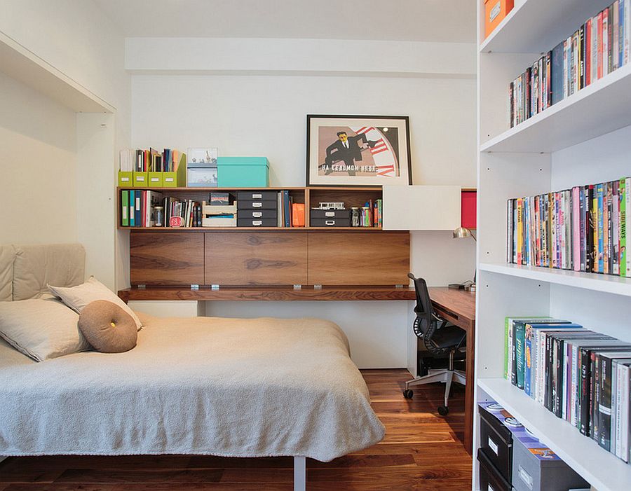 Guest bedroom and home office with ample shelf space [Design: Raad Studio]