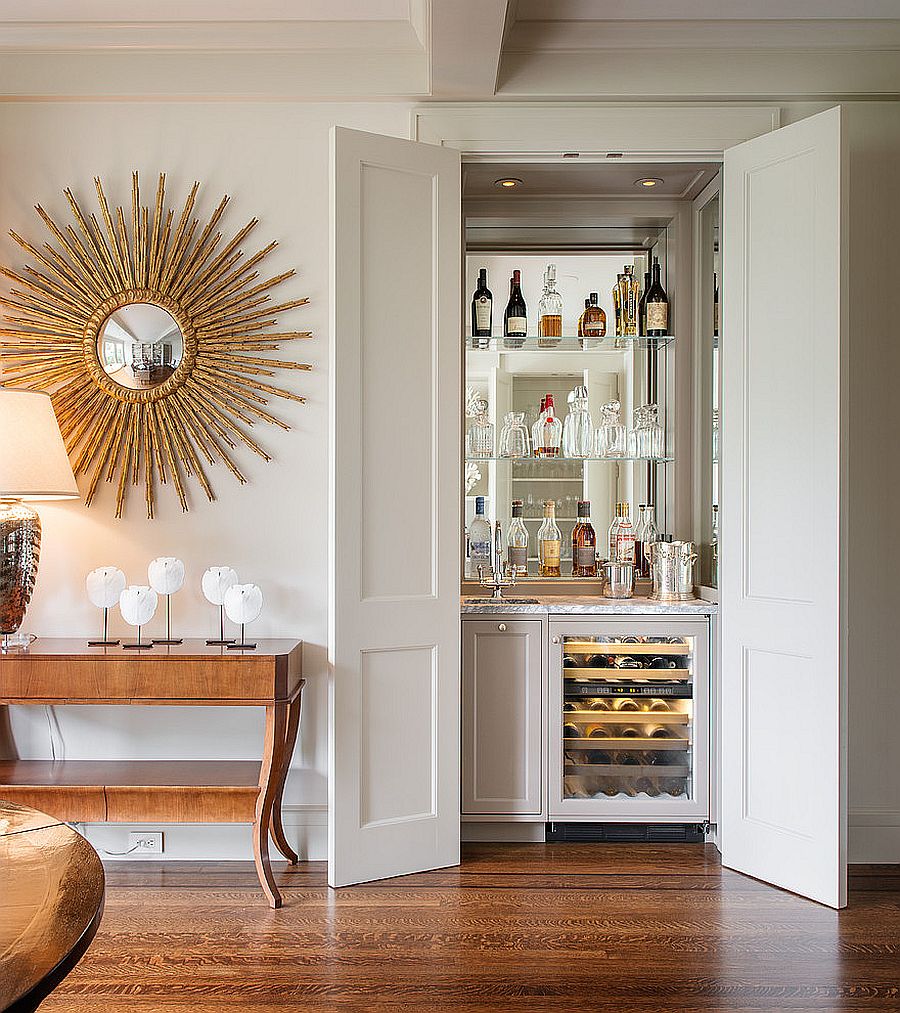 Home bar in the closet complete with a sink and mixer saves up on space 