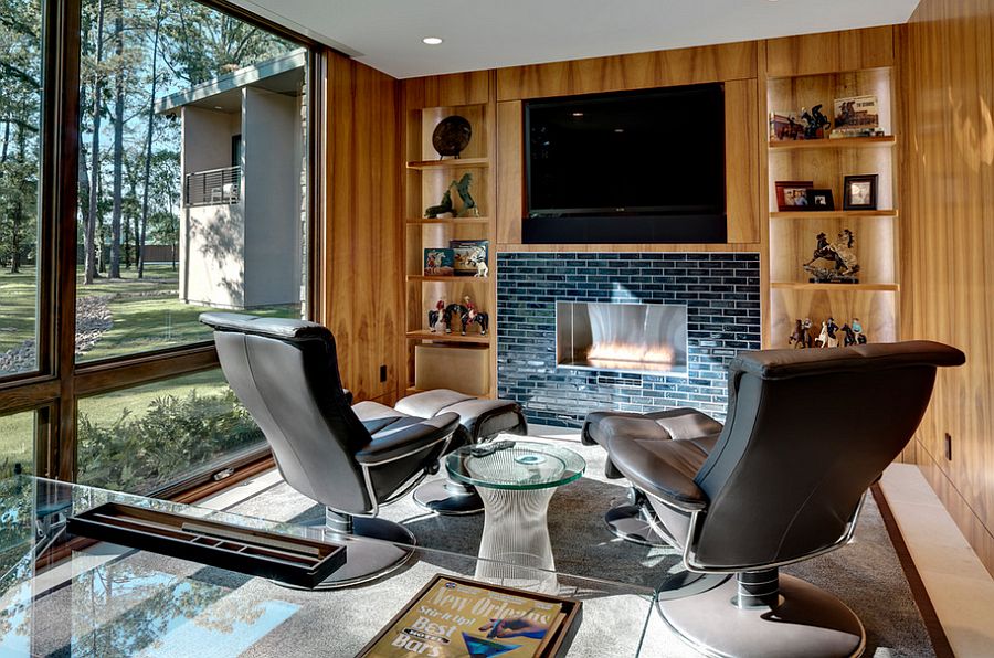 Home office with hidden TV above the fireplace