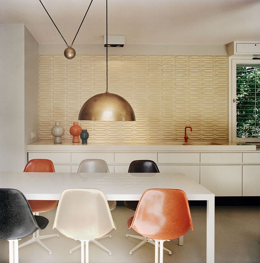 Ingenious pendant lighting and lovely tiled backdrop bring back the essence of the 60s