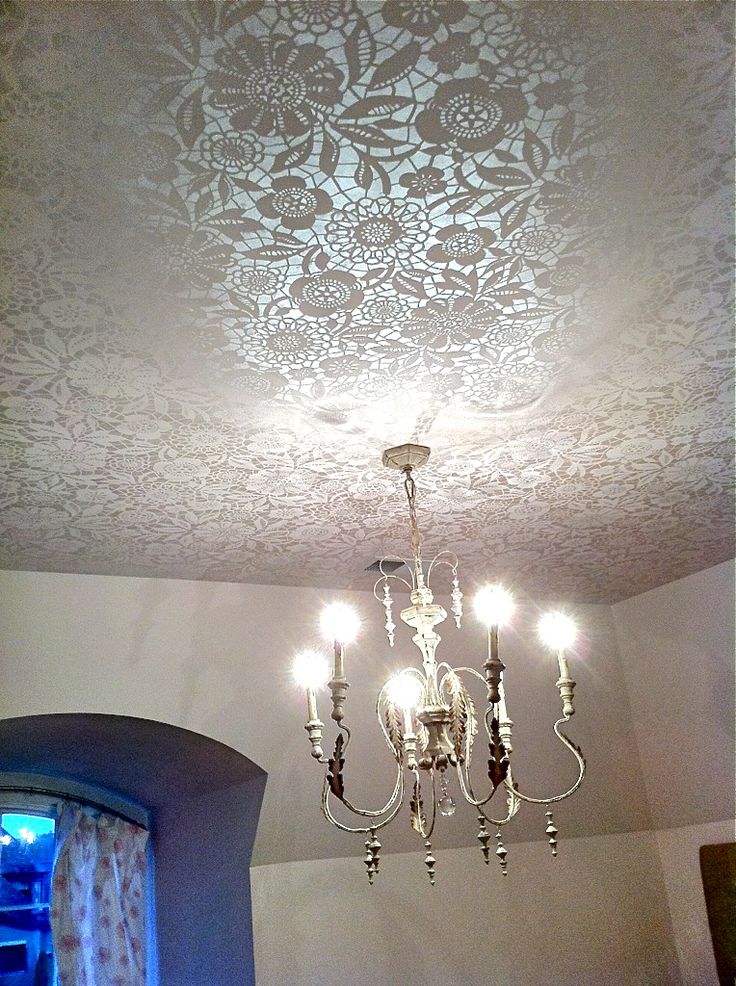 Lace ceiling treatment lit up with chandelier