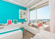 Large-glass-doors-connect-the-living-room-with-the-balcony-and-ocean-view-outside-217x155