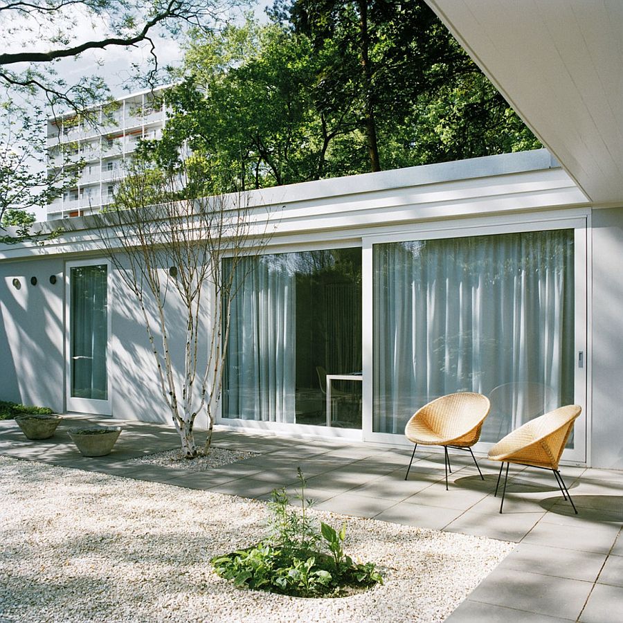 Large sliding glass doors coupled with drapes offer both ventilation and privacy