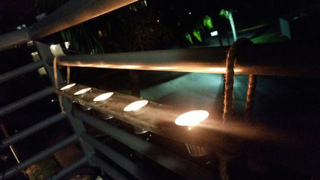 Light up your balcony at night with candles