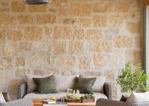 Lovely-patio-with-stone-wall-and-cozy-decor-217x155