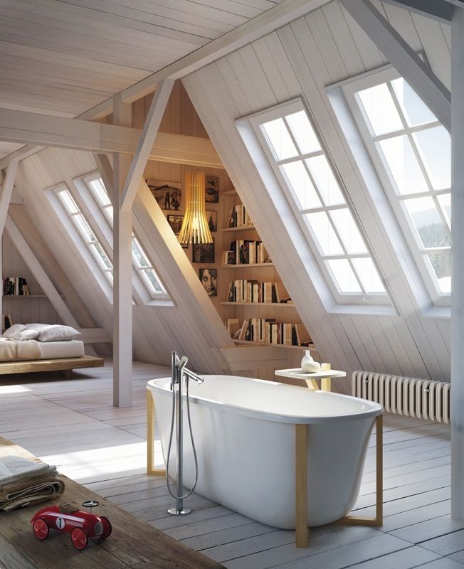 Luxurious soaking tub in the middle of a large attic