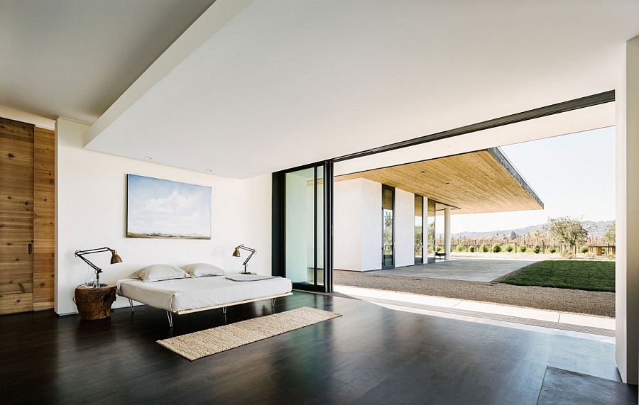 Modern minimal bedroom that opens up towards the vineyards outside