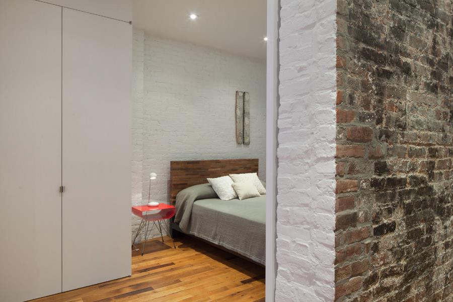 Painted brick in a New York bedroom