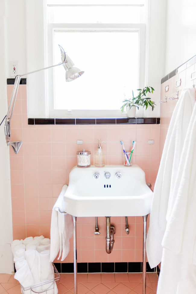 Pink and black bathroom with an original retro sink