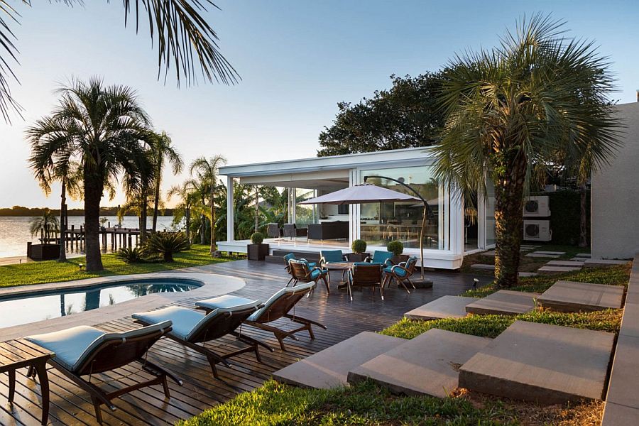 Poolside hangout and sitting area of the lakeside home