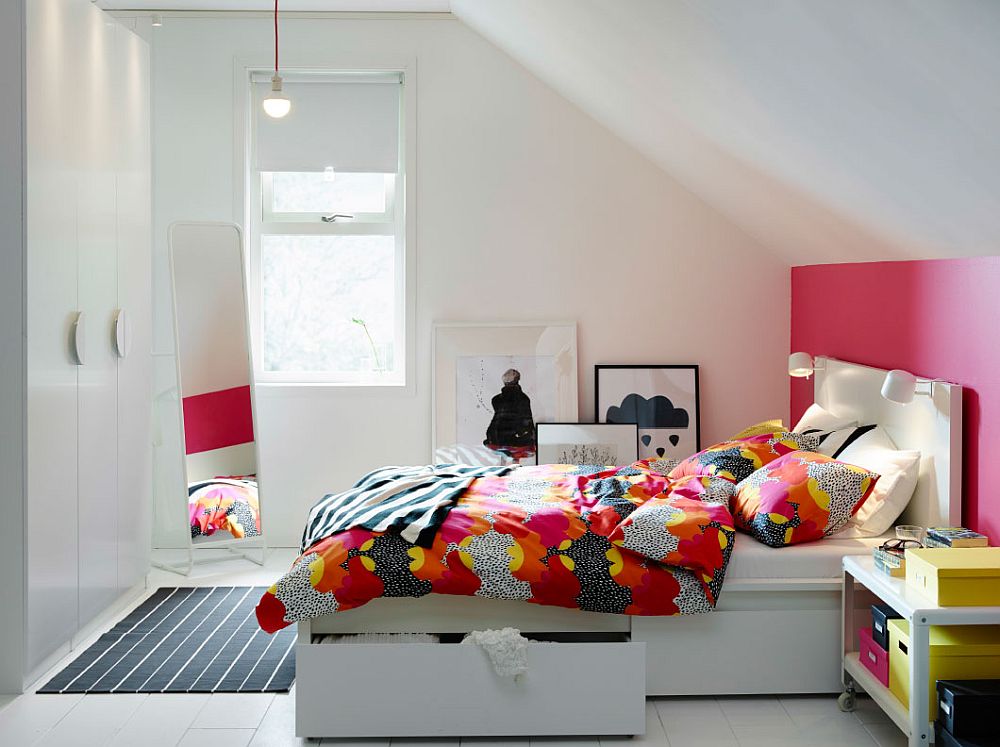 Small IKEA Bedroom idea with bed and storage boxes along with colorful bedding