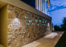 Stone-wall-around-the-house-defines-its-entrance-217x155