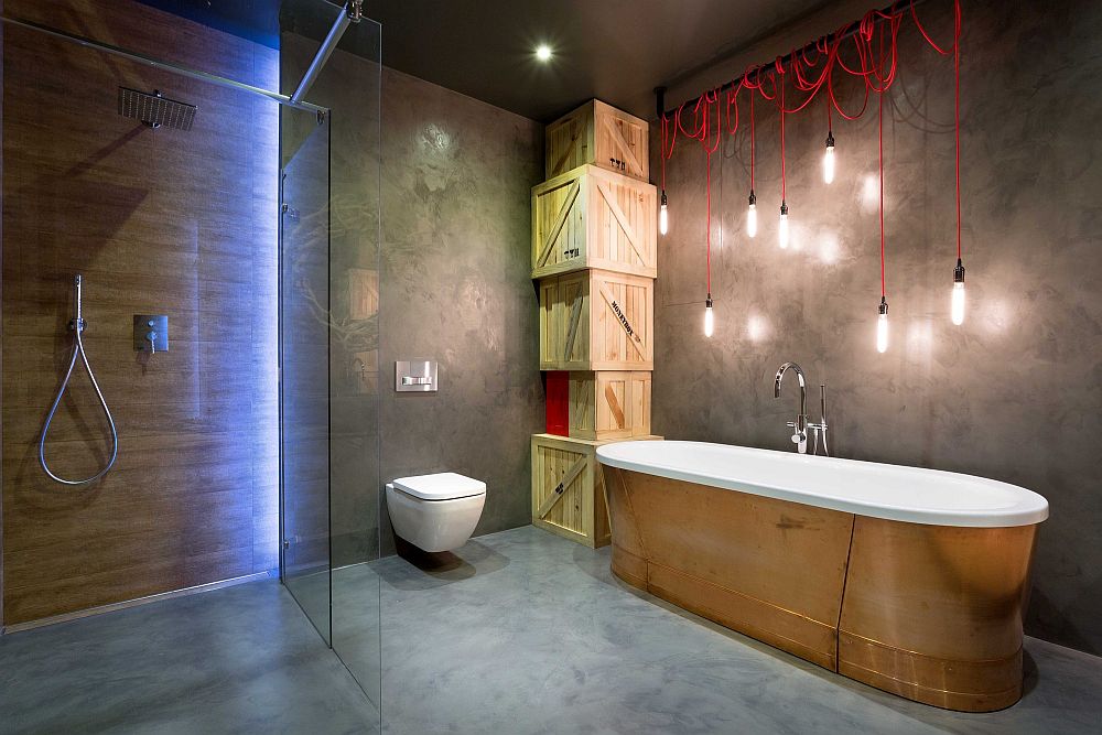 Stripped-down industrial lighting coupled with stunning ambient lighting in the bathroom