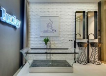 Transparent-bathtub-and-bright-neon-wall-sign-for-the-eclectic-contemporary-bath-217x155