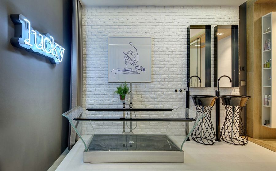 Transparent bathtub and bright neon wall sign for the eclectic contemporary bath