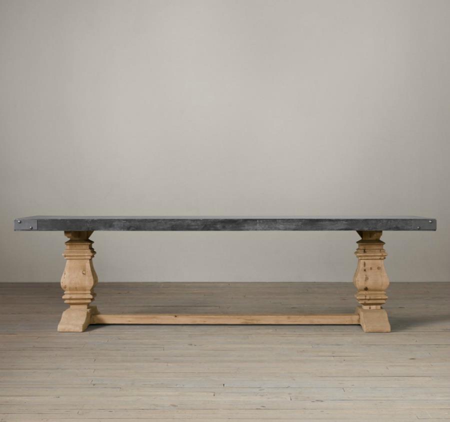 Trestle dining table with a concrete top from Restoration Hardware