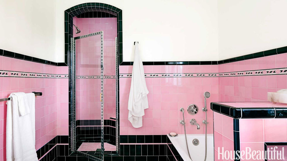 Very bold and retro bathroom in pink and black tile