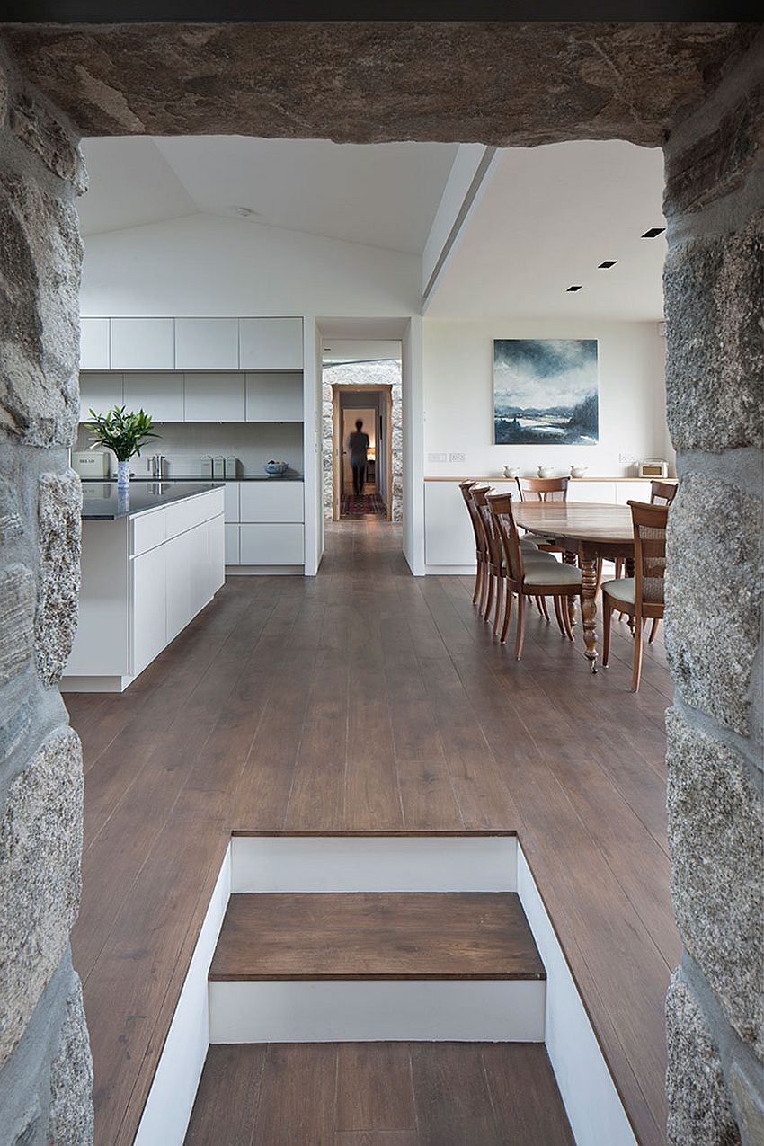 View of the contemporary addition with kitchen and dining from the bedroom