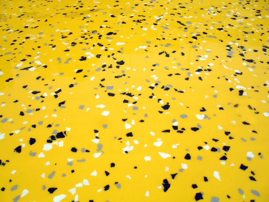 Vivid yellow epoxy floor with chips