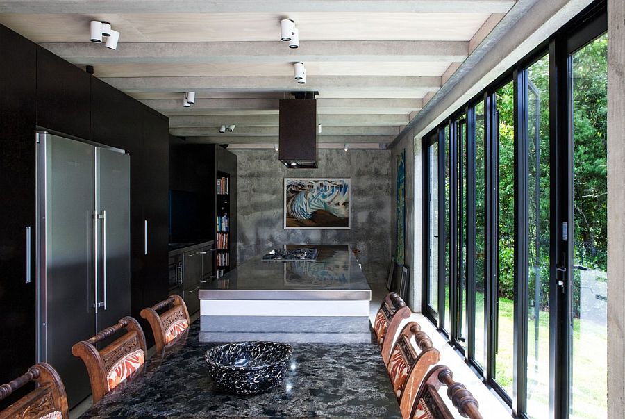 Wall of glass doors connect the kitchen with the outdoors