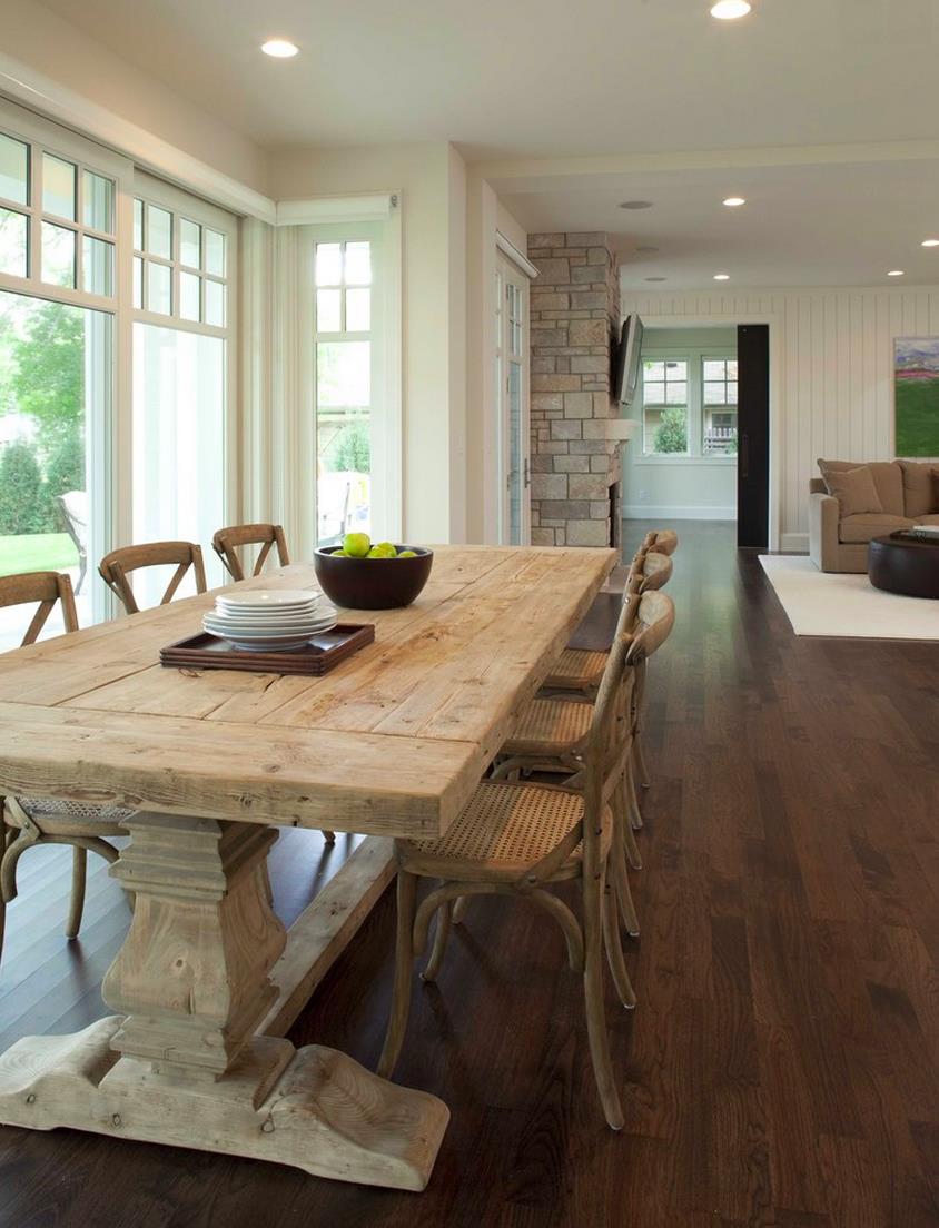 Weathered trestle table in a light and airy dining room