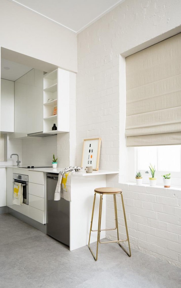 White Brick Wall In A Modern Kitchen 628x999 