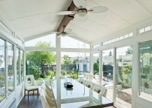 White-cathedral-style-sunroom-with-a-smart-dining-space-217x155