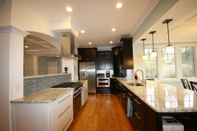 White ice granite in a kitchen filled with wooden tones