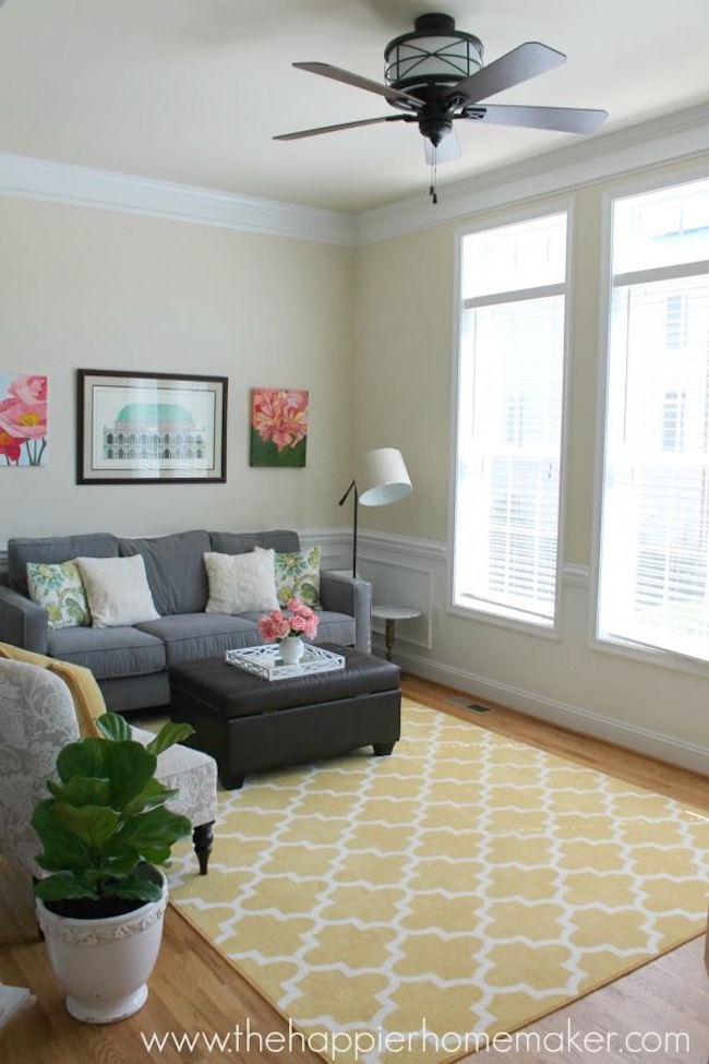 Yellow Moroccan rug brings some much needed color to a living room