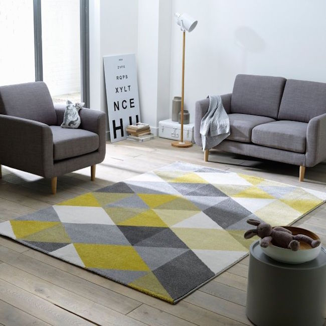 Yellow and gray rug adds a subtle pop of color