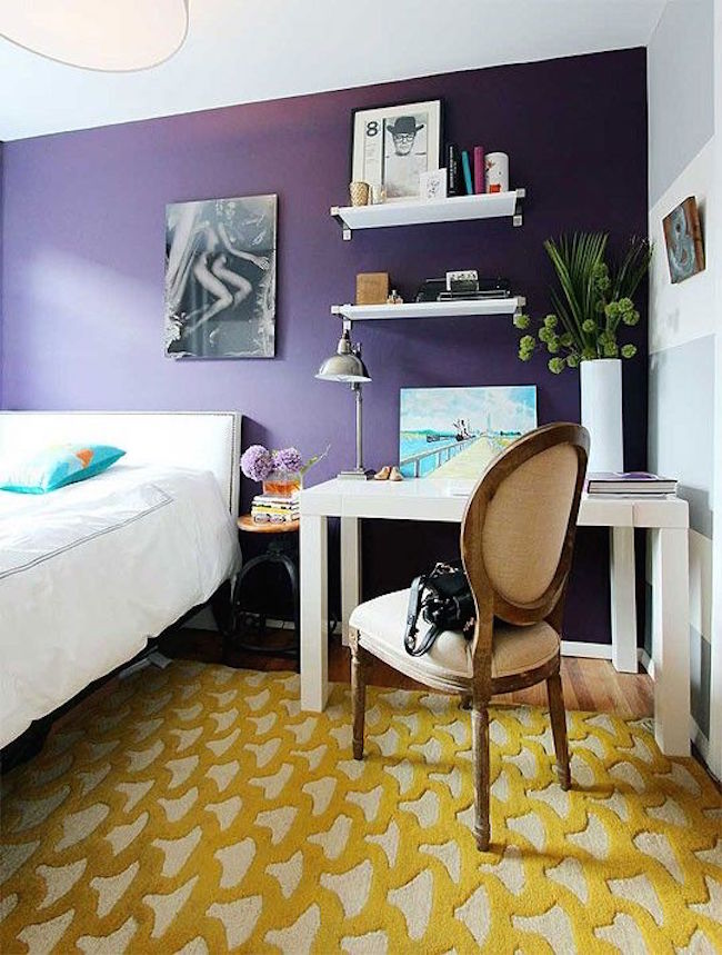 Yellow rug in purple bedroom