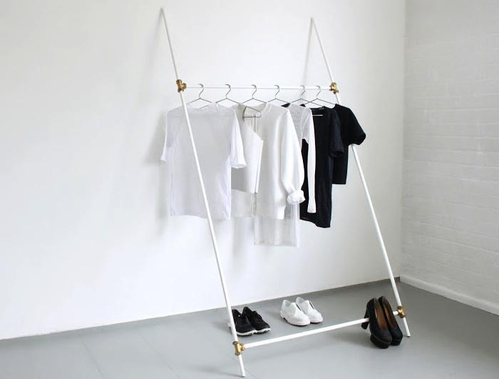 Very minimal and slanted white clothing rack