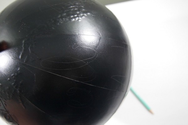Write on globe with a pencil