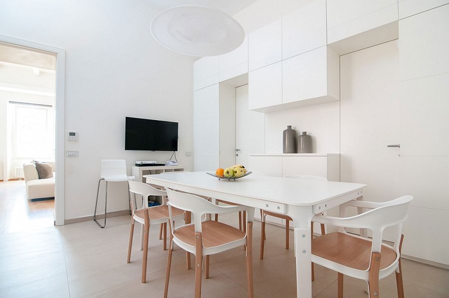 All-white dining space with televsion is a showstopper
