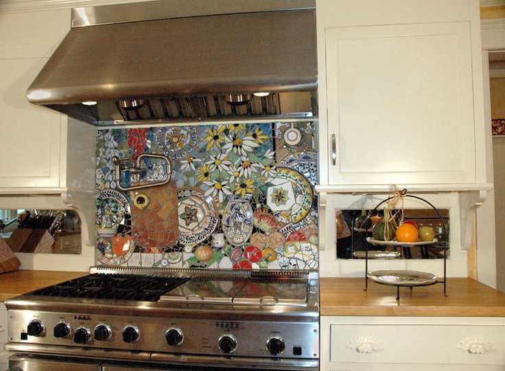 Amazingly detailed stove backsplash with colorful plates