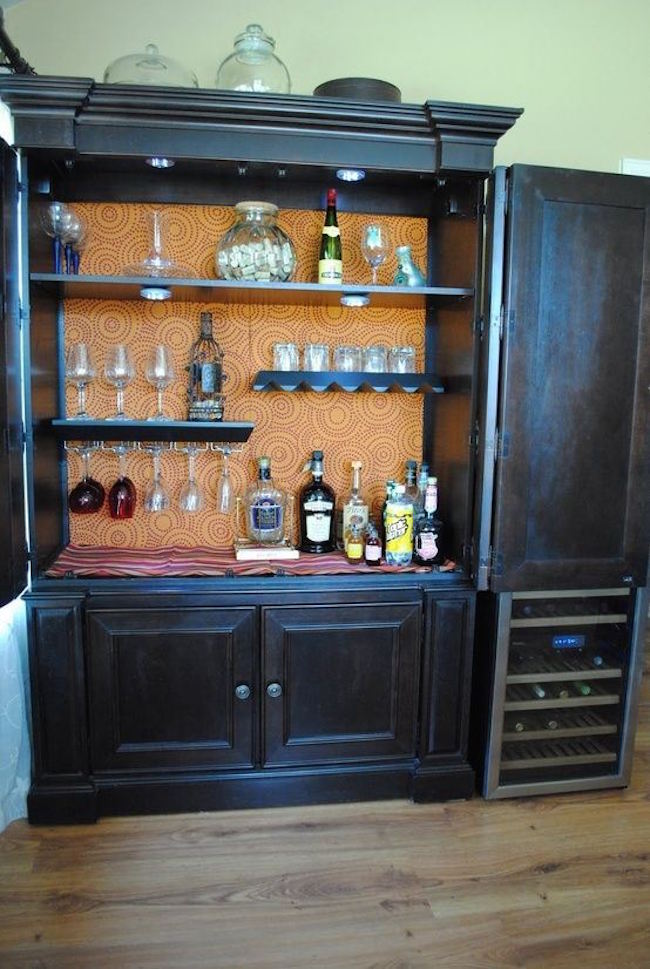 armoire turned into bar storage- yeah this is a necessity in my