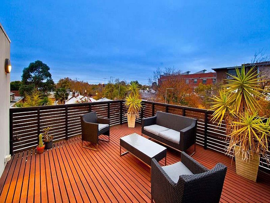 Balconies and roof deck blend into the floor plan of the interior in this warehouse renovation