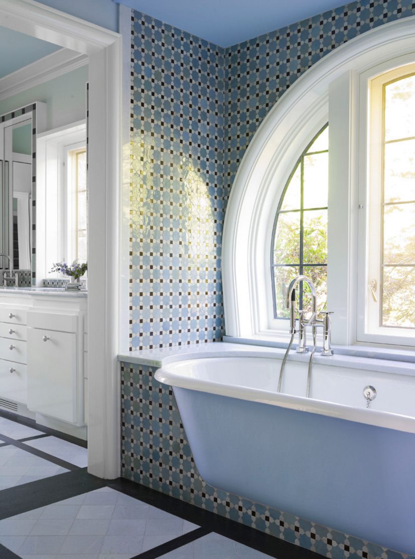 Bathtub with rounded edges in a traditional powder room