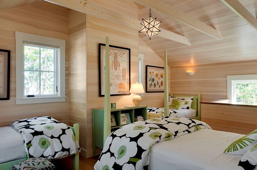 Beach style bedroom with woodsy wall and pops of green