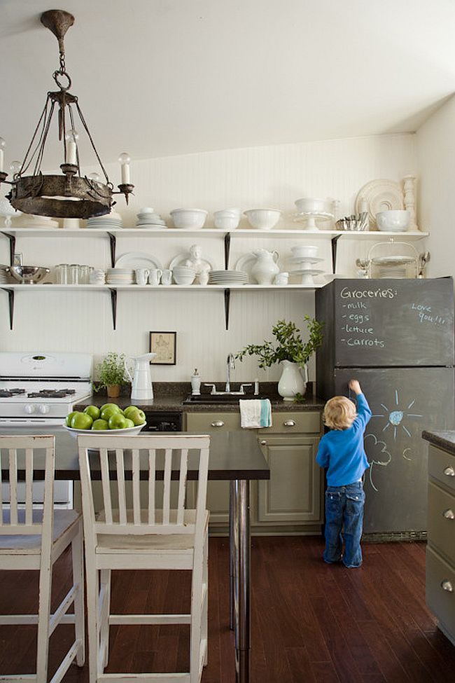Breadboard wall and chalkboard elegance come together in this eclectic kitchen [Design: Lauren Liess Interiors]