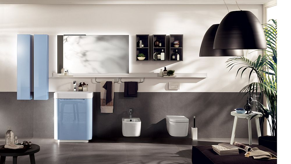 Blue floor stand base and wall hung cabinets create contemporary bathroom