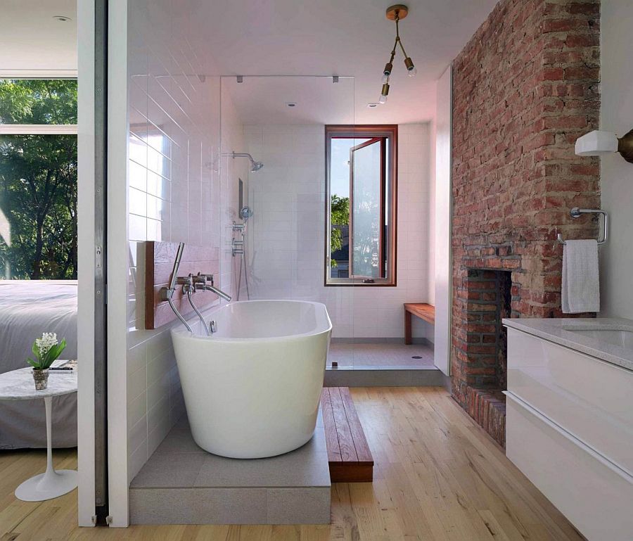 Brick Chimney Breast in the contemporary bathroom with standalone tub