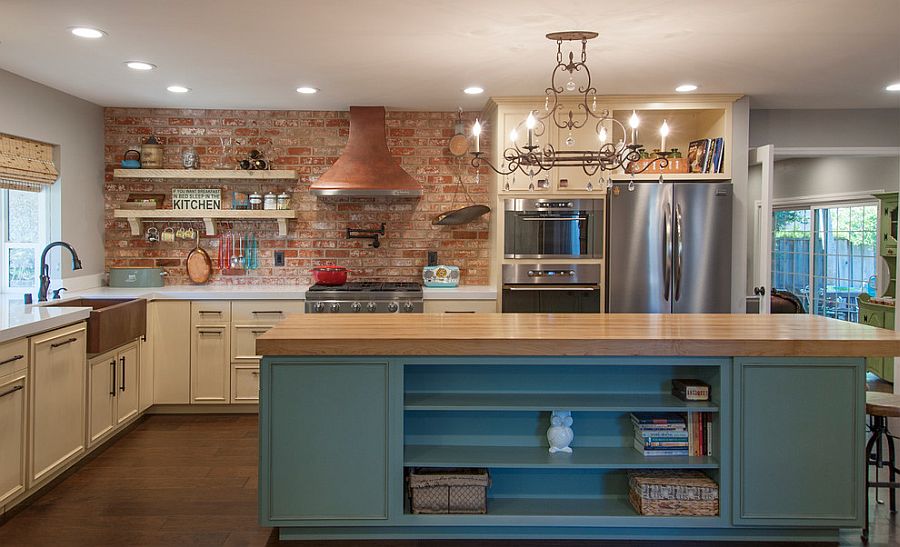 Brick wall adds character and texture to the spacious kitchen with smart island [Design: Tal Goldstein]