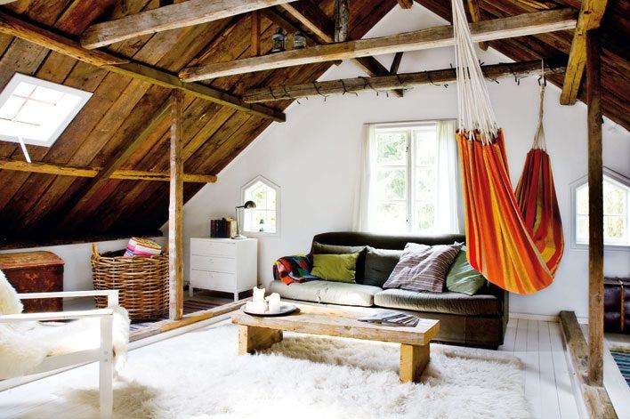 Bright red and orange hammock in a spacious attic