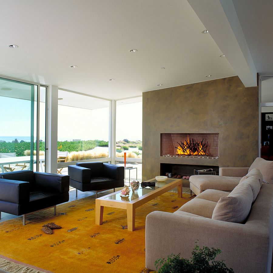 Bright yellow rug adds color and elegance to the clean living room