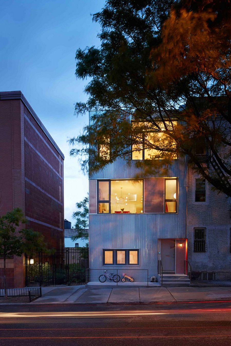 Brilliant lighting lets the entryway and red accents shine through