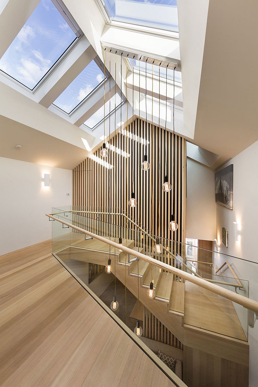 Brilliant pendants coupled with skylights inside the charming Aussie home