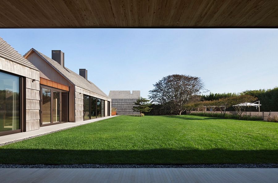 Cedar and weathering steel shape the exterior of the barn-styled home