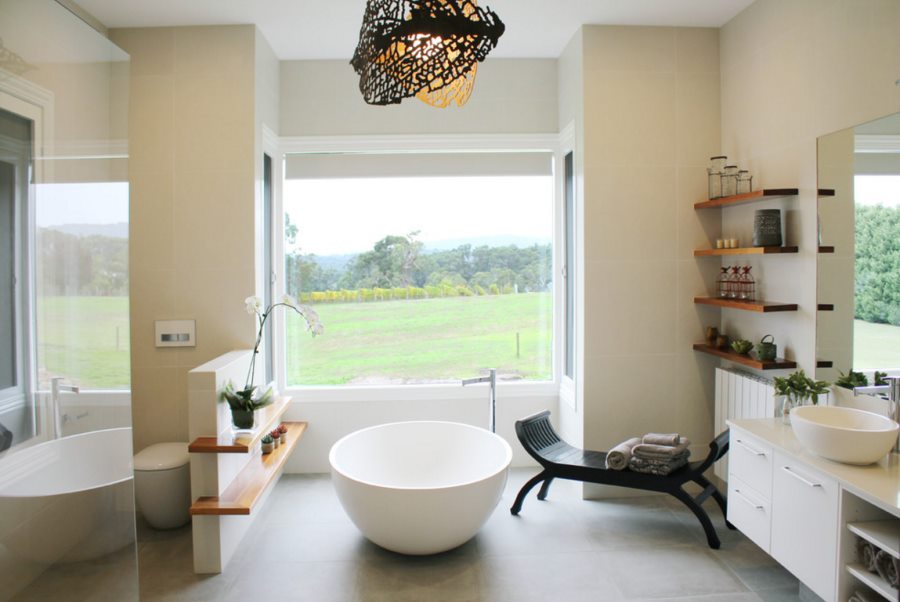 Charming rustic-modern bathroom with a round tub