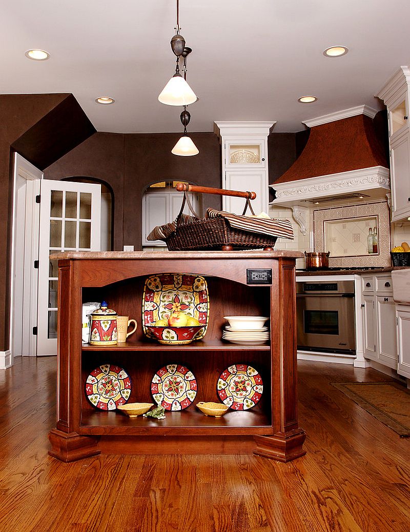 Cherry wood kitchen island with delightful kitchenware on display [Design: Normandy Remodeling]